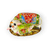 Cow and calf figurine with orange blue green cloth panel and brown rock-like base