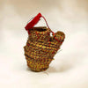 Decorative woven jhari pot with red top cover and small side laddu holder