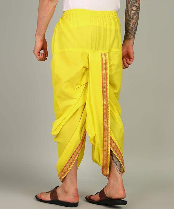 Yellow dhoti pants with gathered waist and vertical zari border on drape