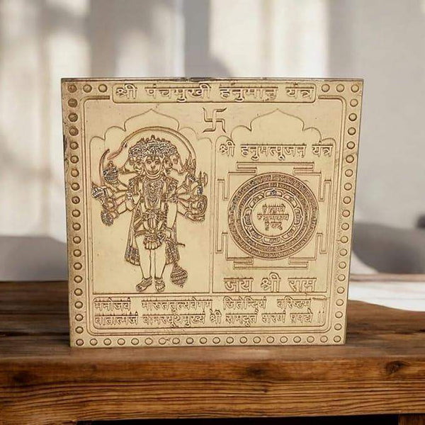 Close-up of pure copper Shri Panchmukhi Hanuman yantra plaque, engraved figure and circular seal