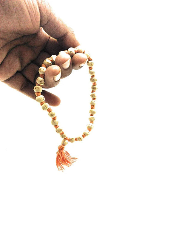 Tusli bead mala necklace with orange tassel and cream/gold beads