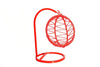 Red hanging swing with oval net cradle and circular base ring