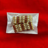 Beaded decorative ornament with pearl and maroon beads on gold backing, in clear pouch