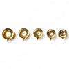 Golden brass pooja diyas, five shallow cups with pointed flame tips on bases