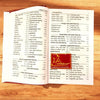 Open Sanskrit shlokas book showing printed pages of Devanagari text and red label