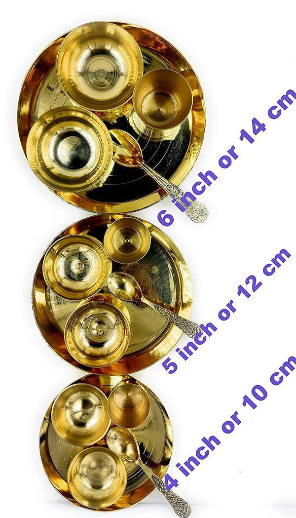 Gold-tone bhog thali set with multiple small bowls on two shallow round plates