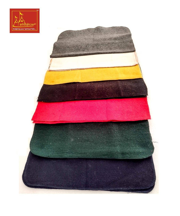 Stack of multicolor wool meditation mats with layered edges and stitched borders