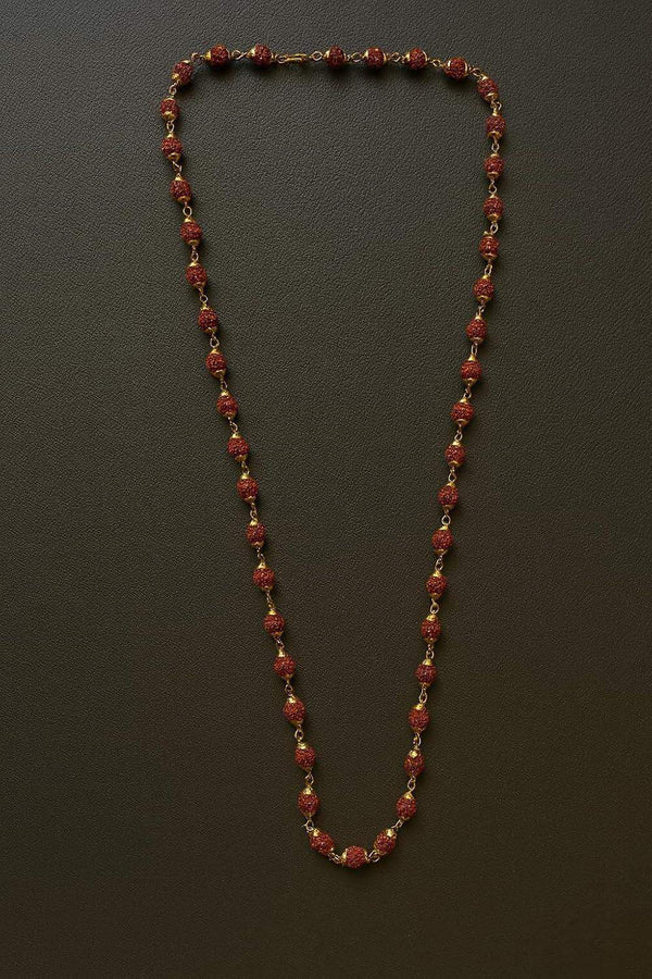 Rudraksha bead mala with golden caps, dark red-brown bead strand with gold spacers.