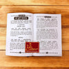 Shree Durga Kavach open pages with dense Hindi text and small emblem