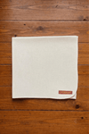 Off-white woolen pooja mat with stitched border and small label corner