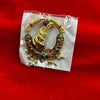 Traditional mala shringar decoration for goddess murti, gold cord with green/red beads