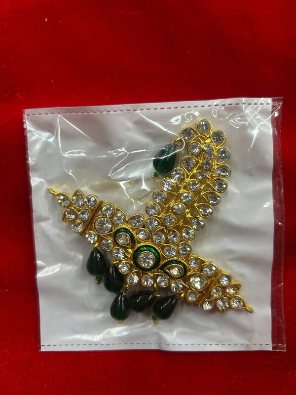 Jeweled gold-tone hanging decoration with green stones and dark bead tassels
