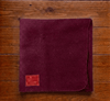 Maroon woolen Aasan mat with logo patch and stitched edge