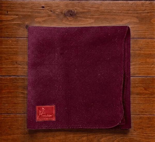 Maroon woolen Aasan mat with logo patch and stitched edge