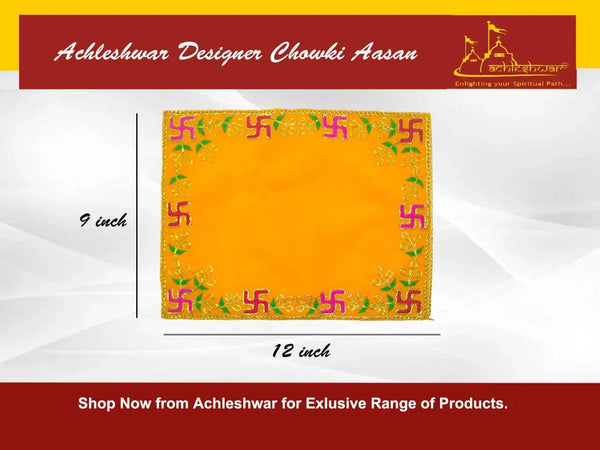 Yellow pooja velvet chowki aasan flat lay with ornate multicolor border and corner patterns