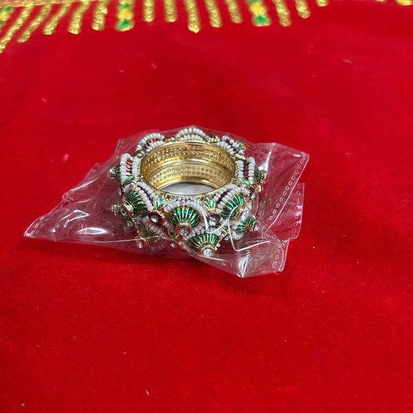 Decorative bangle ornament with gold frame and green-and-white bead tassels