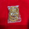 Gold-tone ornate bangles for idol decoration, in plastic wrap