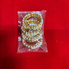 Gold bangles with white pearl beads and green and red stones, in clear pouch