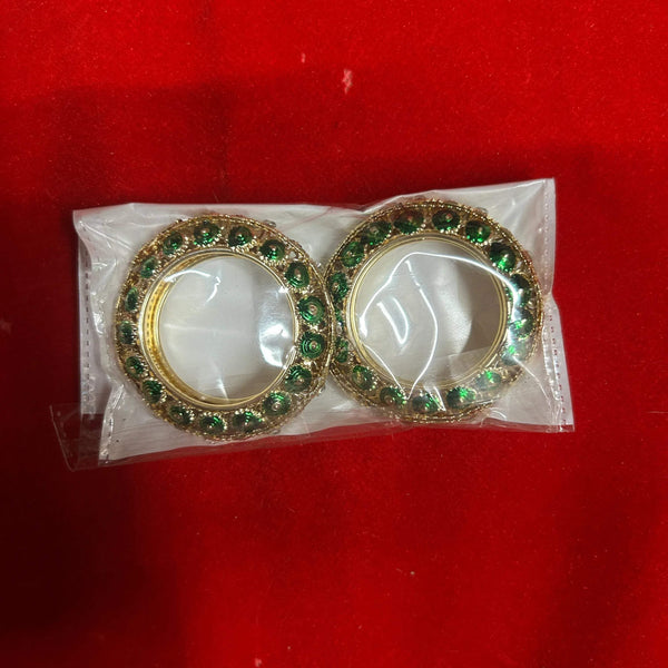 Decorative green and gold bangles with gem-like stones, for puja idol shringar