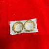 Gold bangles ornament pair with white stones and bead trim on a pouch