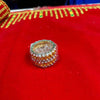 Gold-tone rhinestone bangle close-up with round stones and clear center