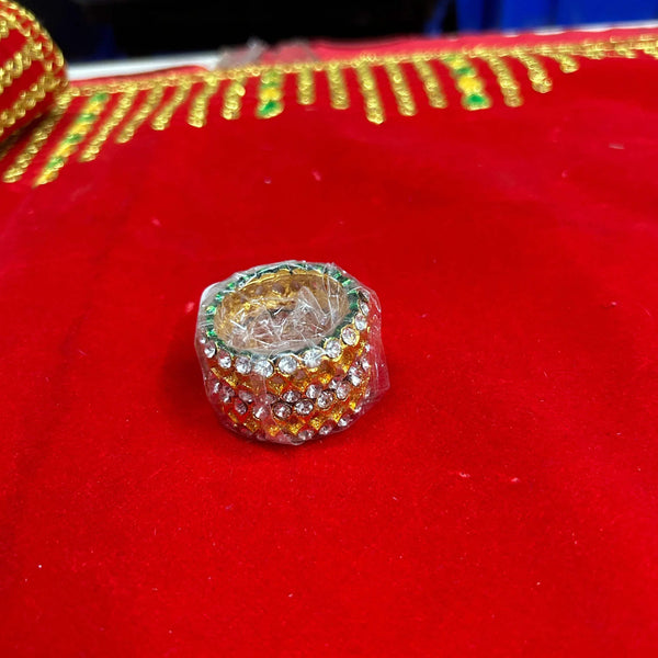 Gold-tone rhinestone bangle close-up with round stones and clear center