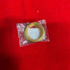 Gold-tone lattice bangle in clear plastic packaging, round oval hoop