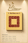 Gold yantra card with maroon grid, header text, and measurement lines