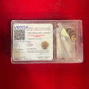 Rudraksha bead in clear box with certificate card, text and barcode visible