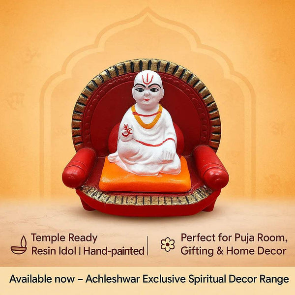 Deity idol on red throne with orange cushion, white robe, and gold-trimmed halo
