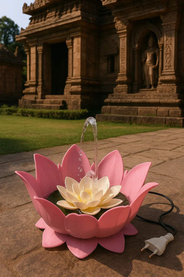 Pink lotus flower water fountain with clear water stream, pale center flower, power cord