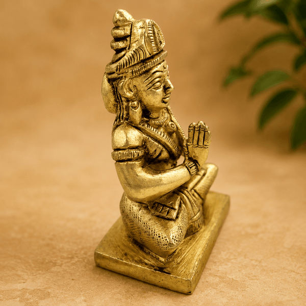 Golden Parvati meditating idol side view with raised prayer hand, on square base