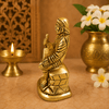 Golden Sai Baba idol statue, seated with hands raised, detailed carved robe