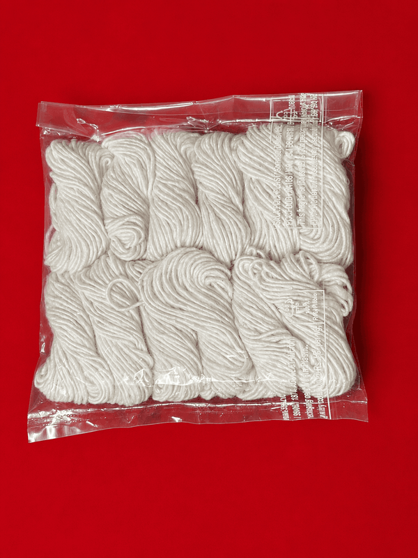 Pack of 12 handmade white cotton jyot wicks for pooja, in a clear bag