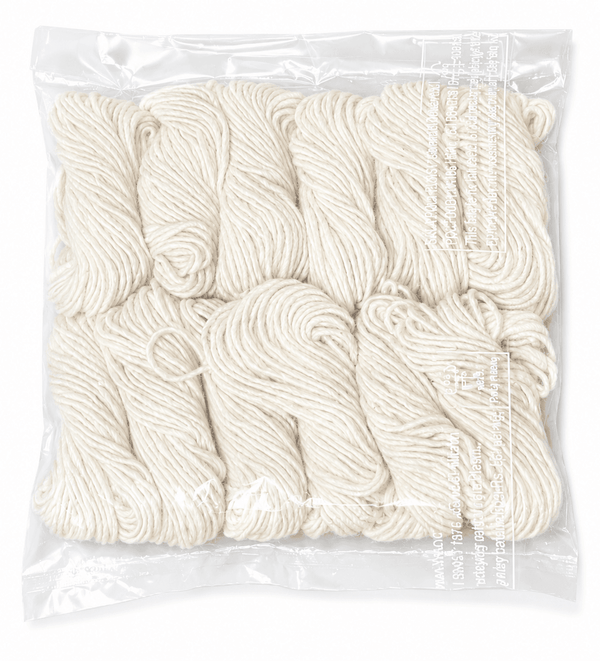Handmade white cotton jyot wicks, coiled threads in a clear plastic bag
