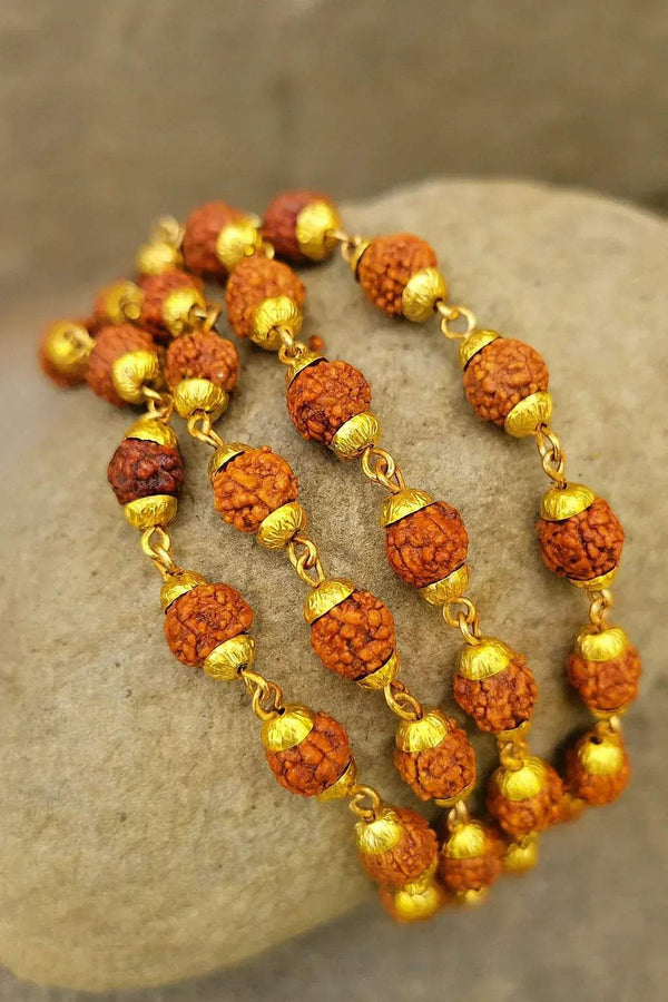 Rudraksha bead mala with gold tone caps and round brown 8mm beads