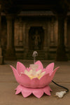 Pink lotus water fountain with pale lotus center and clear water stream, power cord and plug