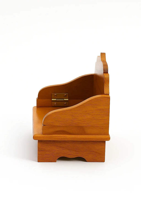 Wooden Bal Gopal singhasan side view with arched back panel and brass-toned clasp