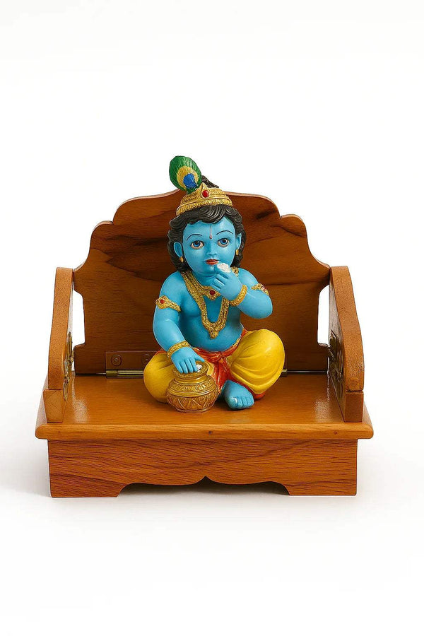 Wooden Bal Gopal singhasan with seated blue baby deity, brown carved throne