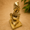 Golden Parvati meditating idol seated with hands in prayer, on a square base