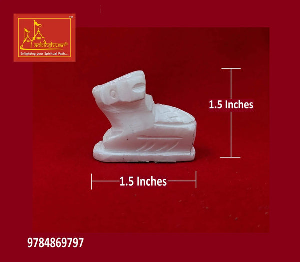 White marble Nandi bull figurine, seated, shown with 1.5 inches size