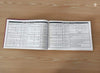 Open panchang book with printed date and horoscope tables on both pages