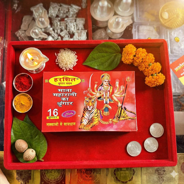 16-piece pooja shringar kit in red tray with goddess box, flowers, coins, leaves
