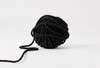 Black cotton thread ball with hanging thread