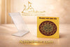 Yantra card in clear acrylic stand, gold circular emblem on yellow card.