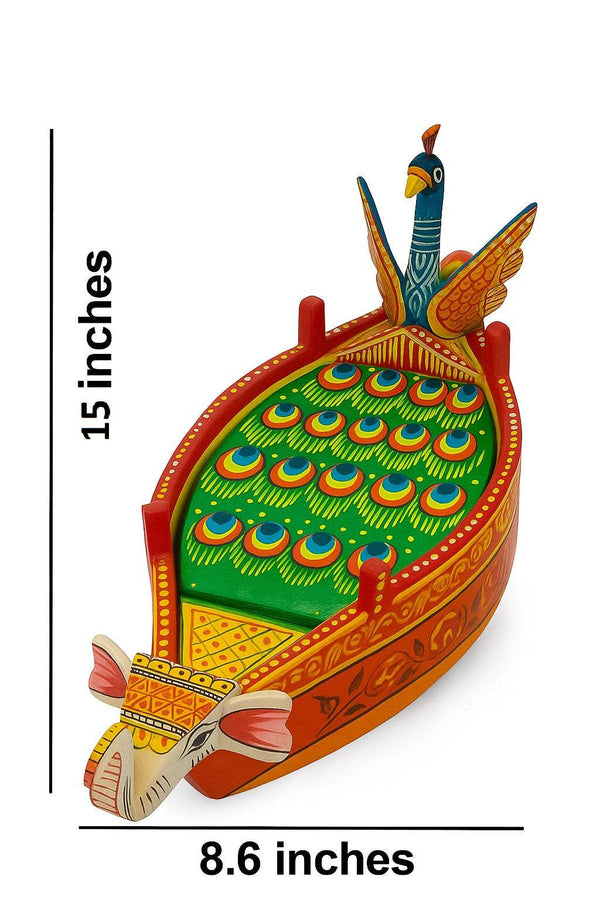 Decorative wooden Krishna boat figurine, green base with orange carved borders, peacock top
