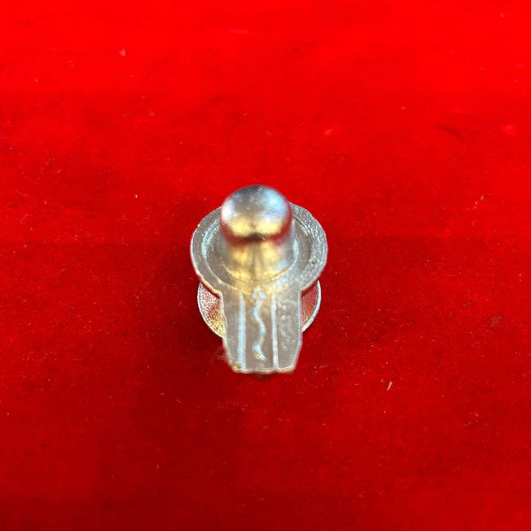 Mercury shivling idol with long side opening cutouts and rounded top finial