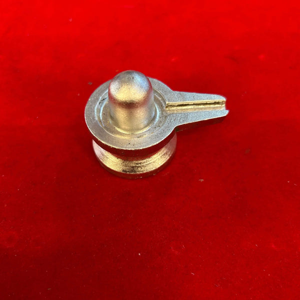 Silver-toned shivling stand with domed top and horizontal side handle, close-up