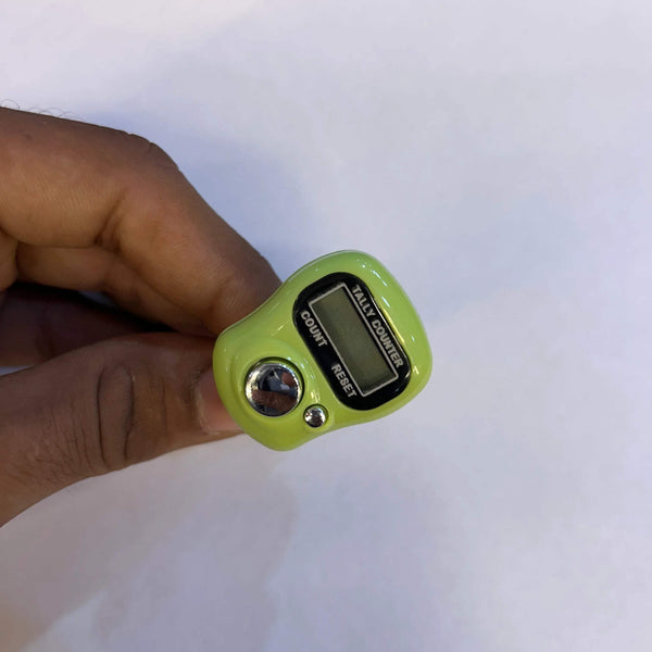 Green digital tally counter close-up with LCD display and count/reset labels on buttons.
