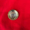 Small round brass pooja thali with ridged outer rim and shallow interior